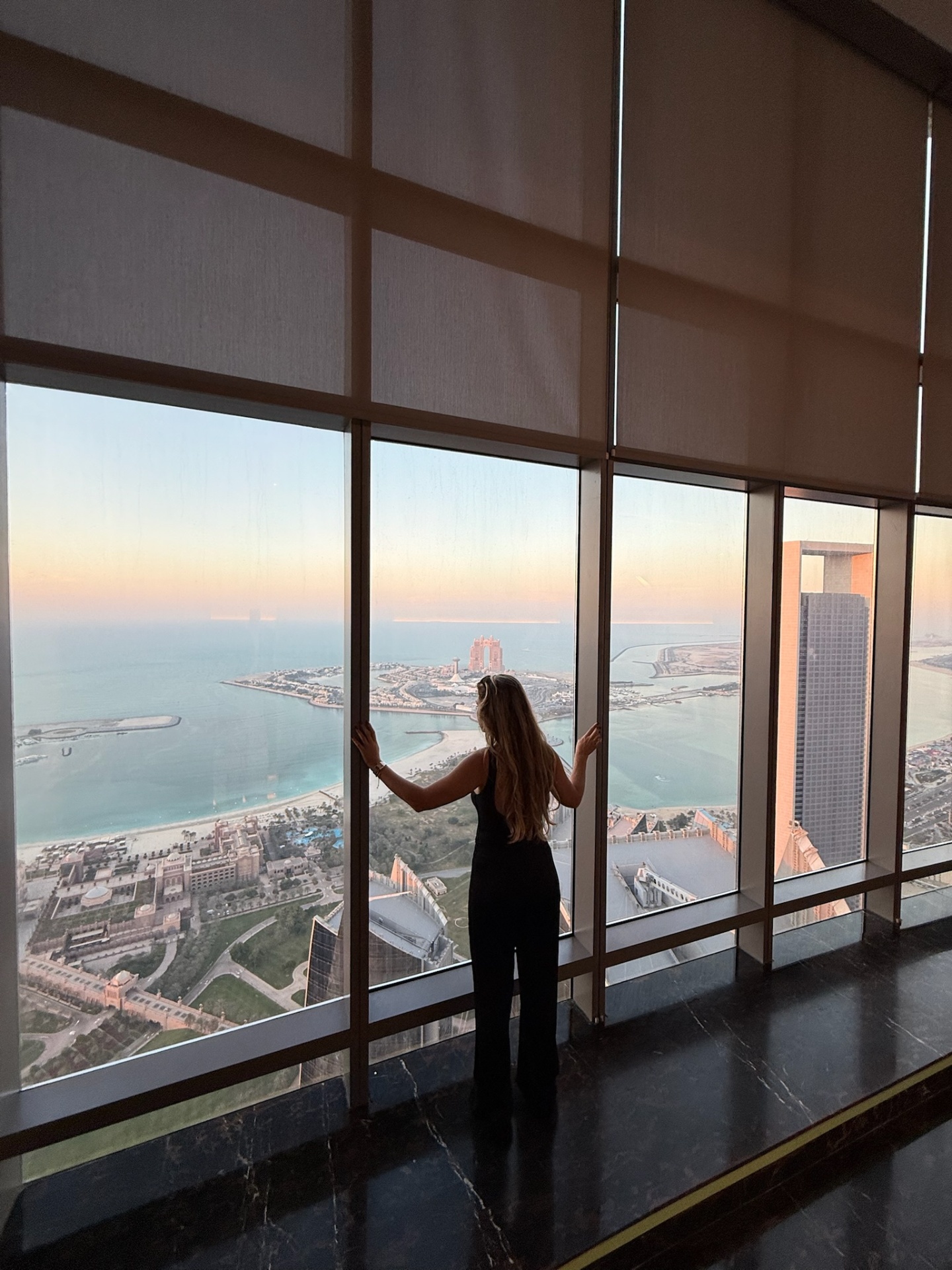 Teresa Cunha overlooking the Abu Dhabi coastline at sunset