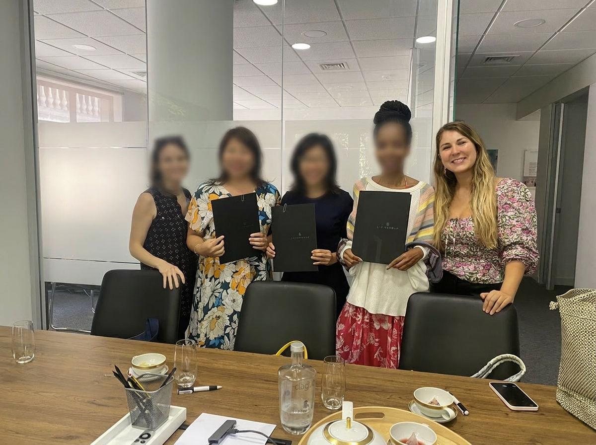 Teresa Cunha with clients in New York